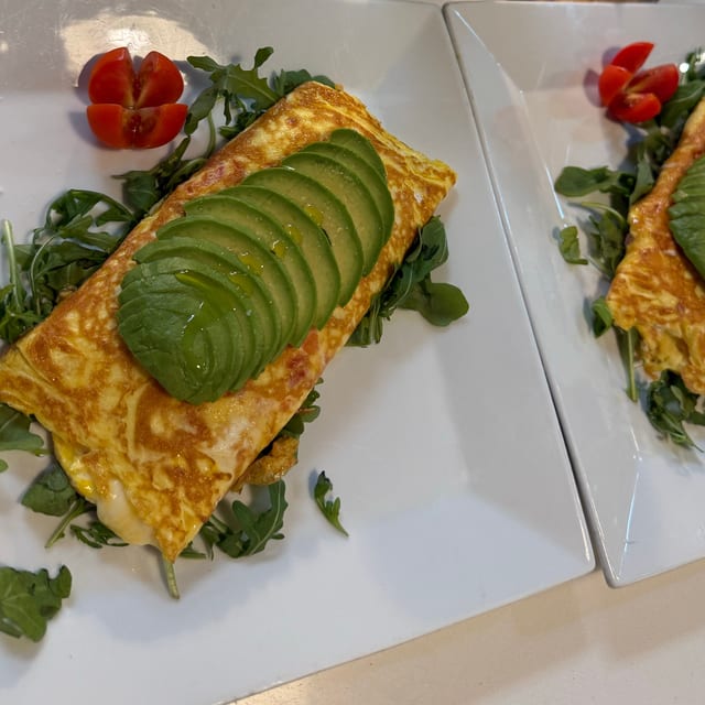 AVOCADO GOAT CHEESE OMELET (avocado, Goat Cheese, Mozzarella, Baked Cherry Tomatoes, 3 Eggs).